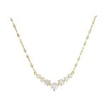 Χρυσό κολιέ Κ14 διακομημένο με επτά ζιργκόν σε σχήμα "V"